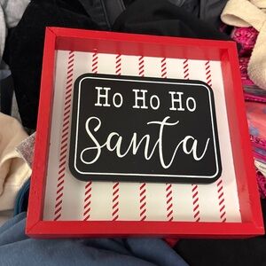 Red and White Striped Santa Sign